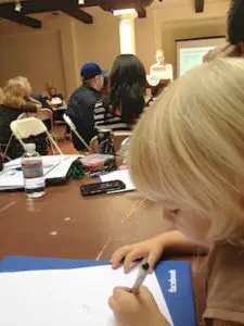Sydney "taking notes" at a facebook "how to use Facebook to grow your business" event.